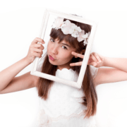 communion-girl-grimacing-with-frame-on-her-face